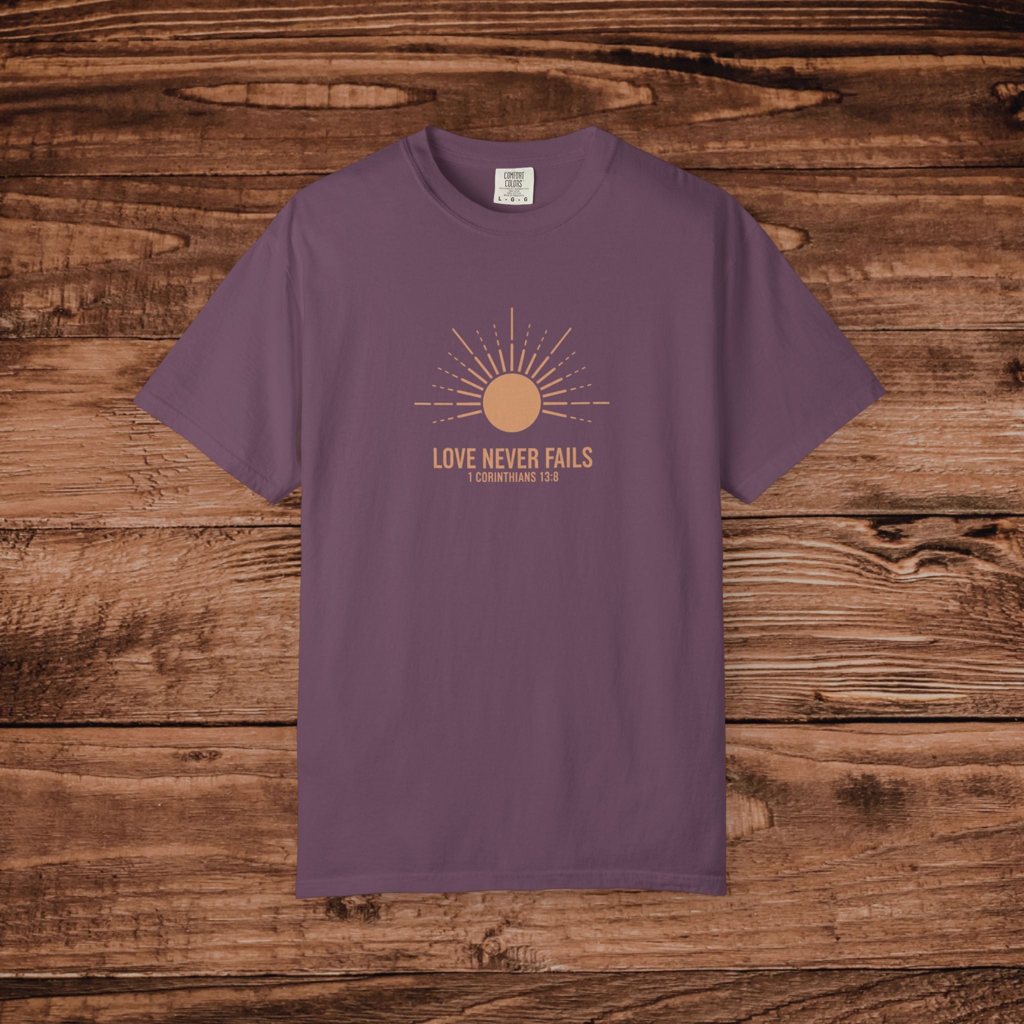 Love Never Fails sun graphic T-Shirt | faith scripture typography