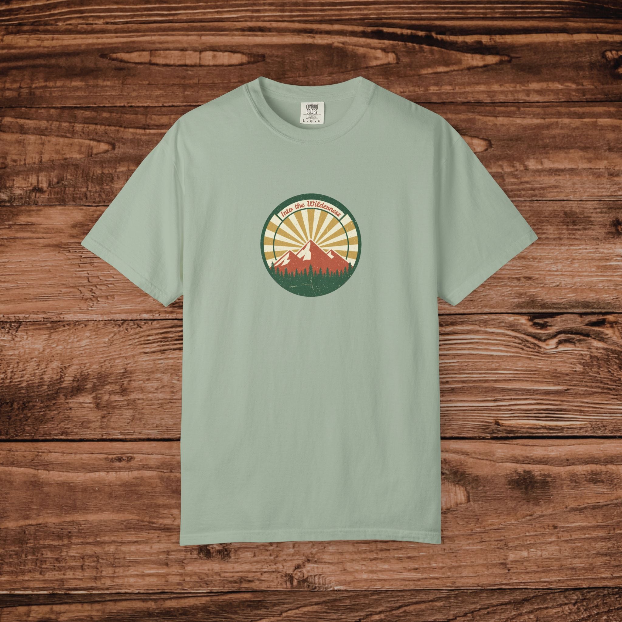 Into the Wilderness Sunrise Mountain Badge T-Shirt | Retro Outdoor Nature Graphic