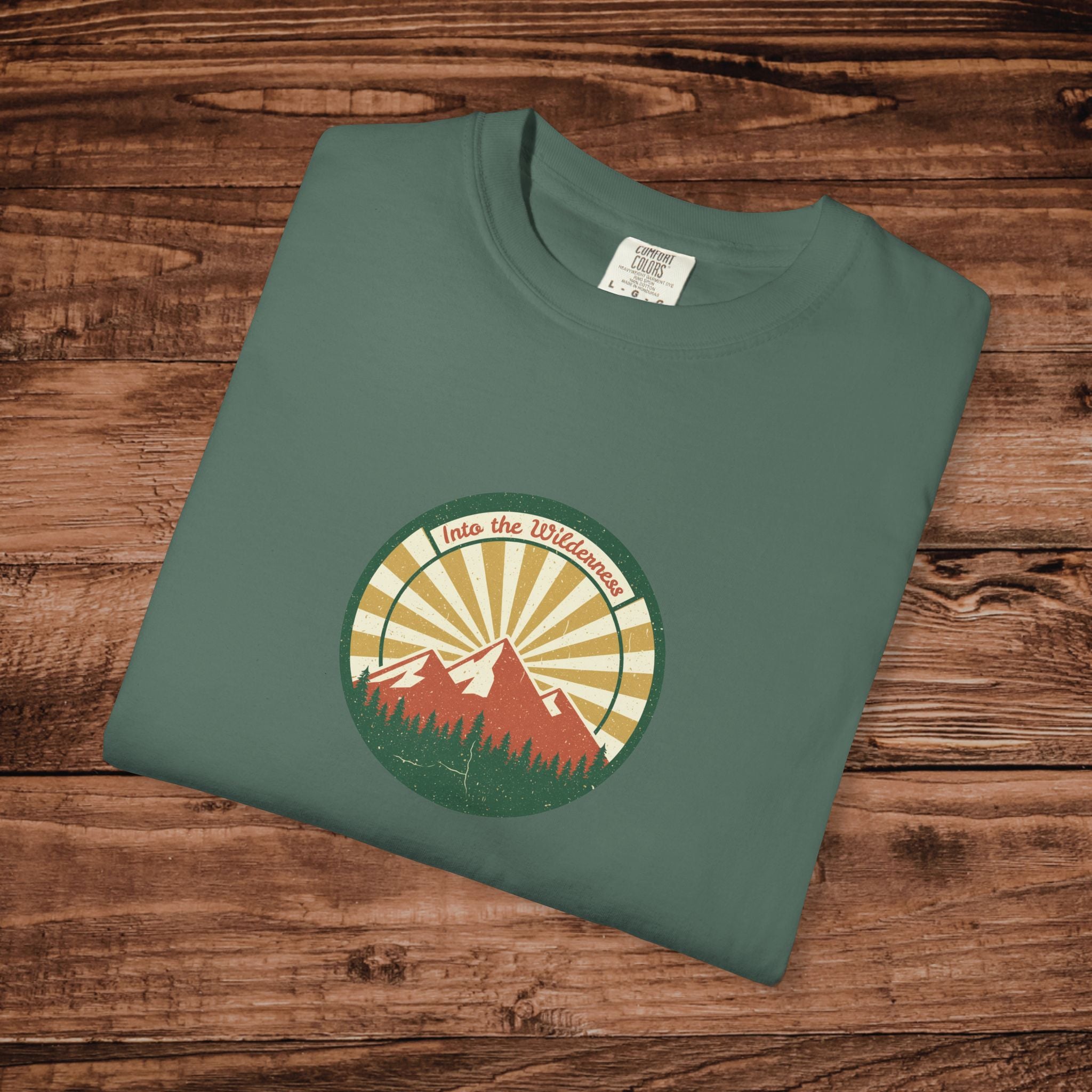 Into the Wilderness Sunrise Mountain Badge T-Shirt | Retro Outdoor Nature Graphic