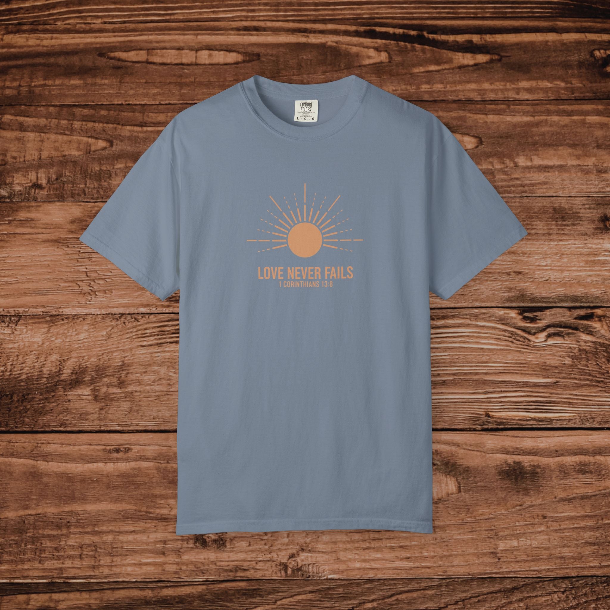 Love Never Fails sun graphic T-Shirt | faith scripture typography