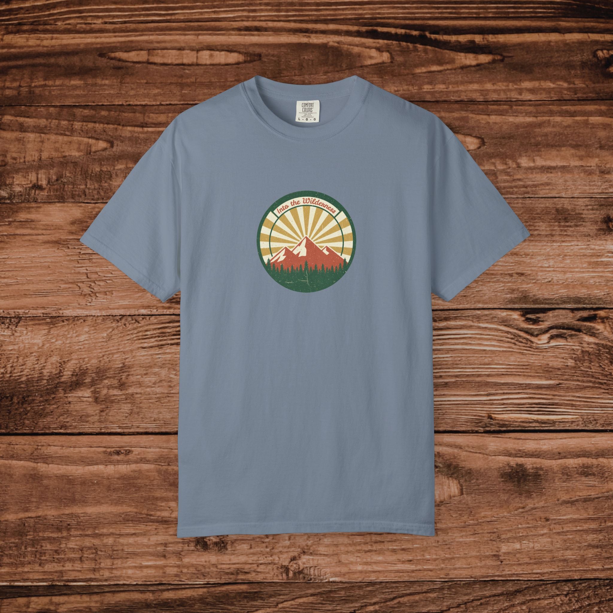 Into the Wilderness Sunrise Mountain Badge T-Shirt | Retro Outdoor Nature Graphic