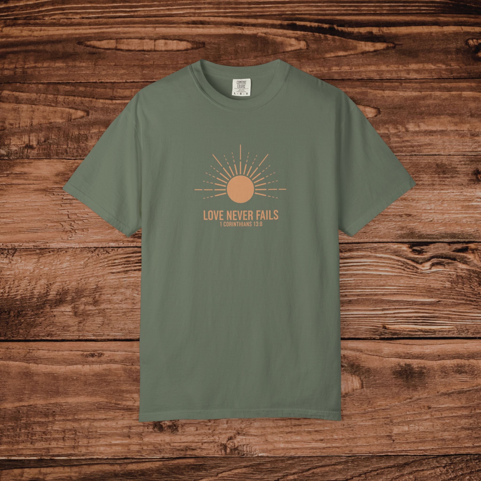 Love Never Fails sun graphic T-Shirt | faith scripture typography